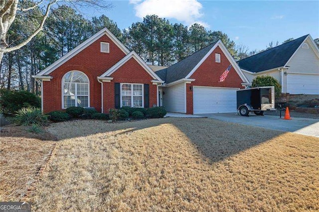 view of front of house with a garage and a front lawn