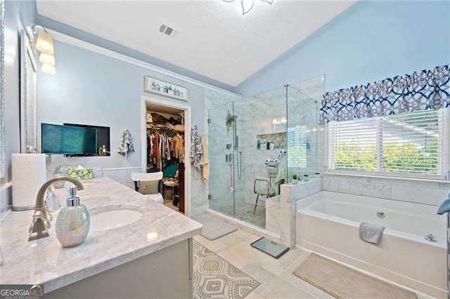 bathroom with vanity, plus walk in shower, vaulted ceiling, tile patterned flooring, and ornamental molding