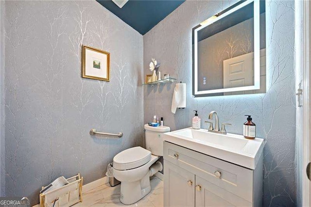 bathroom with vanity and toilet