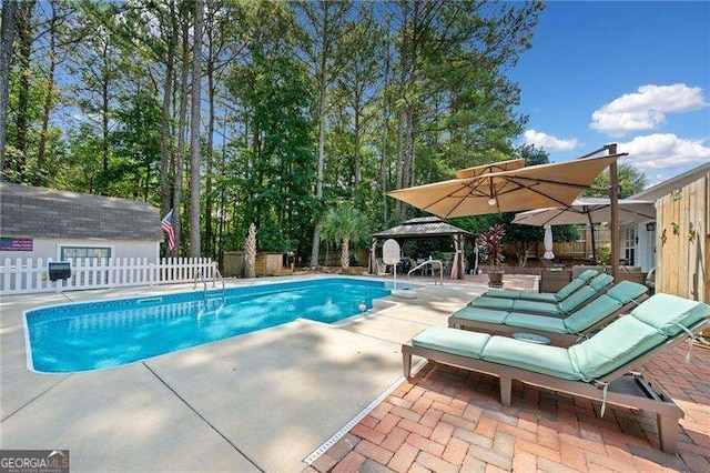 view of pool with a gazebo and a patio