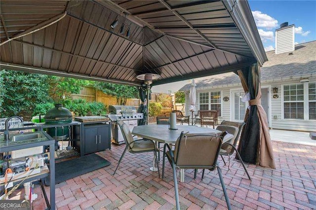 view of patio / terrace featuring a gazebo and sink