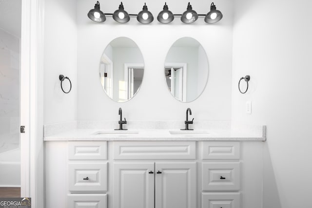 bathroom featuring vanity and separate shower and tub