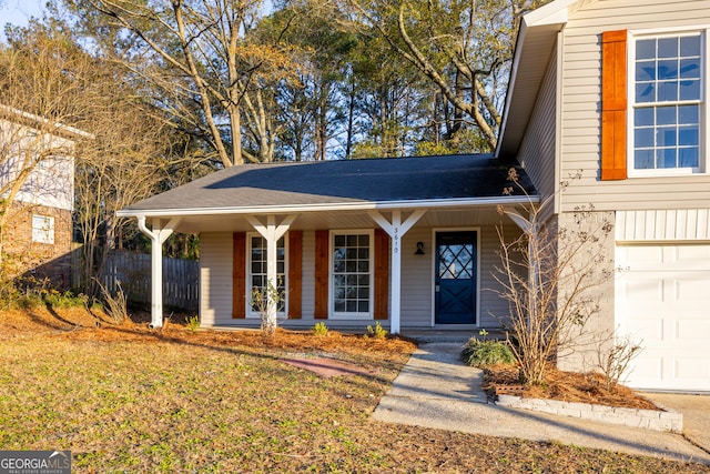 view of front of house with a porch and a garage