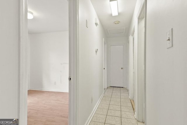 corridor with light tile patterned flooring