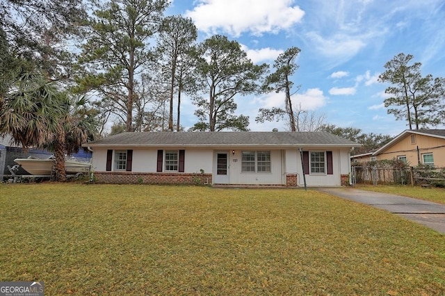 ranch-style home featuring a front yard