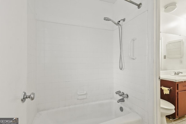 full bathroom with vanity, toilet, and tiled shower / bath combo