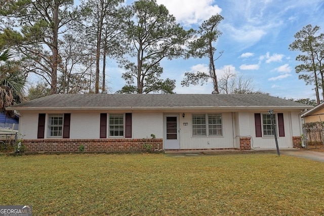 ranch-style home with a front lawn