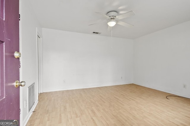 spare room with ceiling fan and light hardwood / wood-style flooring