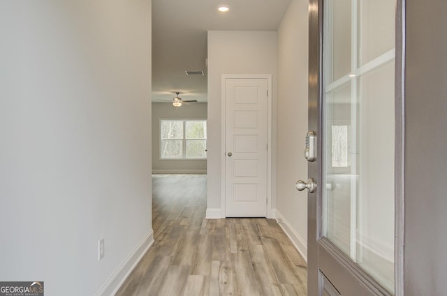 corridor featuring light wood-type flooring