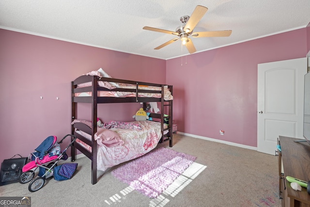 bedroom featuring ceiling fan, crown molding, light carpet, and a textured ceiling