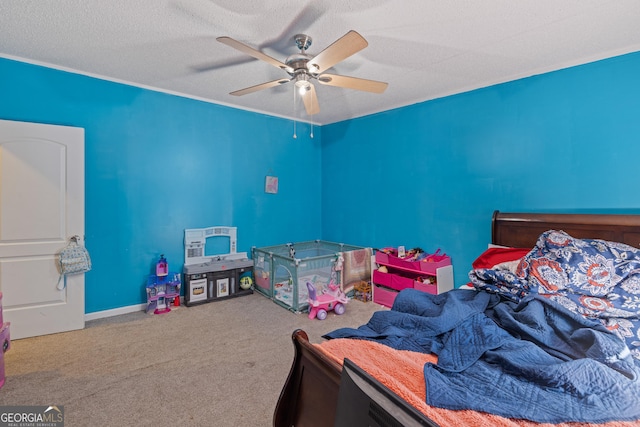 carpeted bedroom with ceiling fan and a textured ceiling