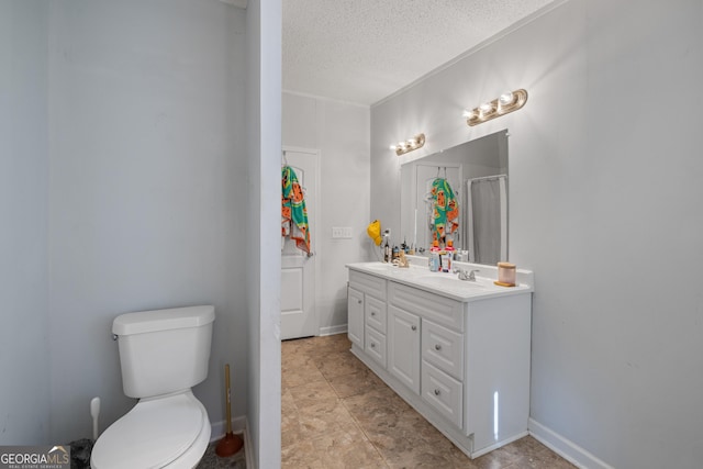 bathroom featuring walk in shower, vanity, a textured ceiling, and toilet