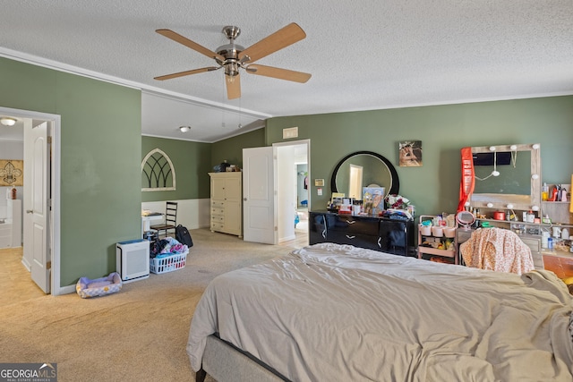 carpeted bedroom featuring a textured ceiling, vaulted ceiling, and ceiling fan