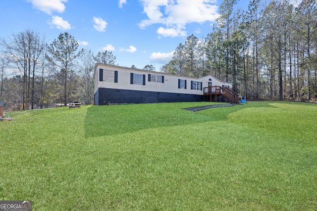 exterior space with a wooden deck and a front lawn