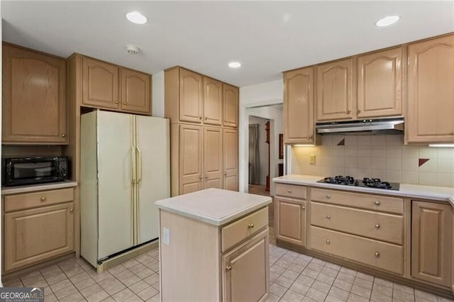 kitchen with light tile patterned floors, backsplash, black appliances, a kitchen island, and light brown cabinetry