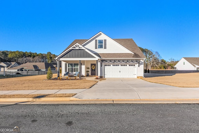 view of front of house featuring covered porch and a garage