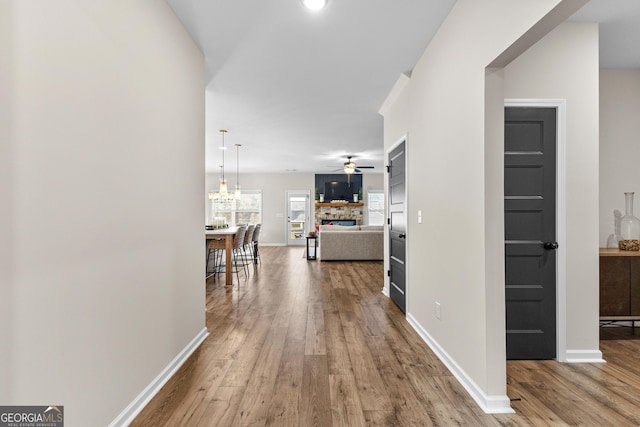 hall with hardwood / wood-style floors