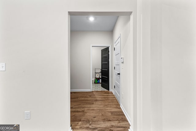 hallway featuring wood-type flooring