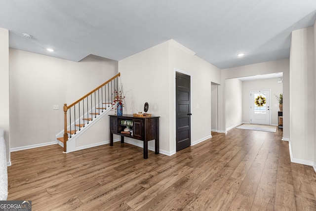 foyer entrance with hardwood / wood-style floors