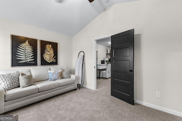 living room featuring lofted ceiling and carpet