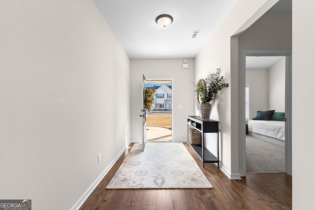 hall with dark hardwood / wood-style floors