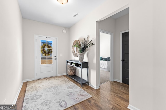 foyer entrance featuring hardwood / wood-style floors