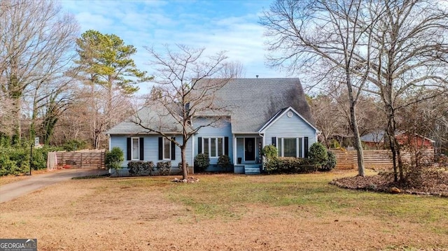 new england style home with a front yard