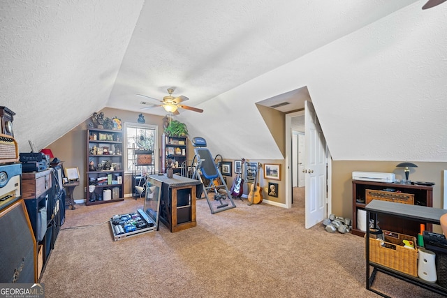 office with carpet flooring, ceiling fan, a textured ceiling, and vaulted ceiling