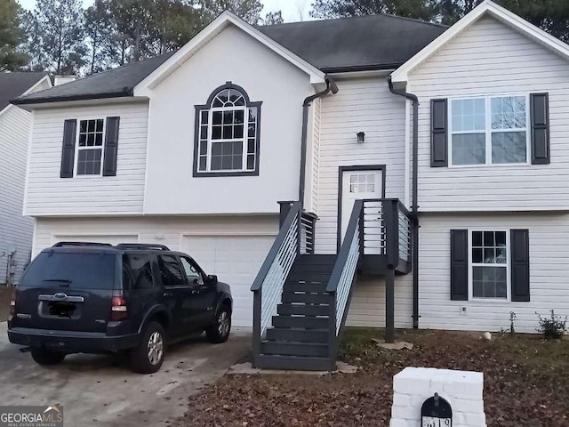 raised ranch featuring a garage