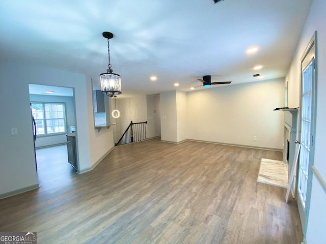 unfurnished living room featuring wood-type flooring