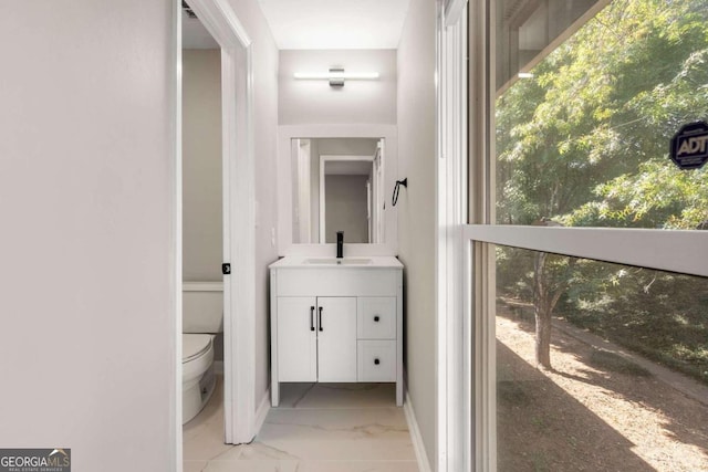 bathroom with vanity and toilet