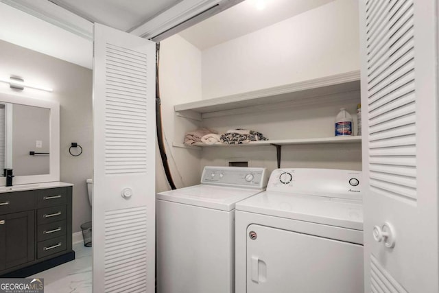 laundry room featuring separate washer and dryer and sink