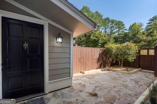 property entrance featuring a patio