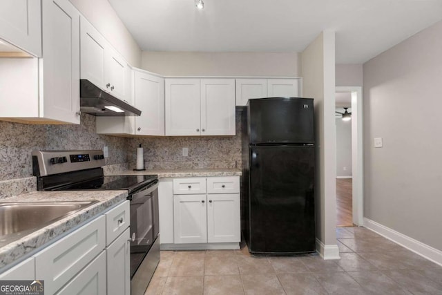 kitchen with black refrigerator, electric range, ceiling fan, decorative backsplash, and white cabinetry