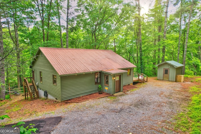 view of front of house with a storage shed