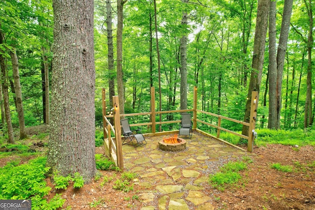 view of patio / terrace with a fire pit