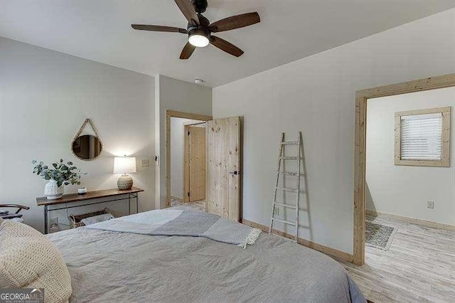 bedroom with ceiling fan and light wood-type flooring