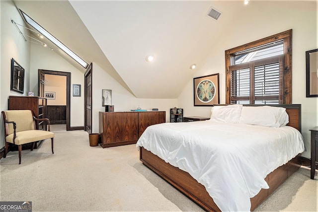 carpeted bedroom with vaulted ceiling