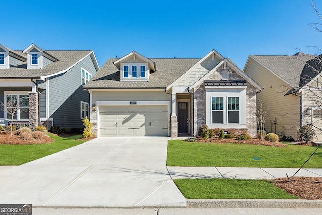 craftsman house with a garage and a front lawn