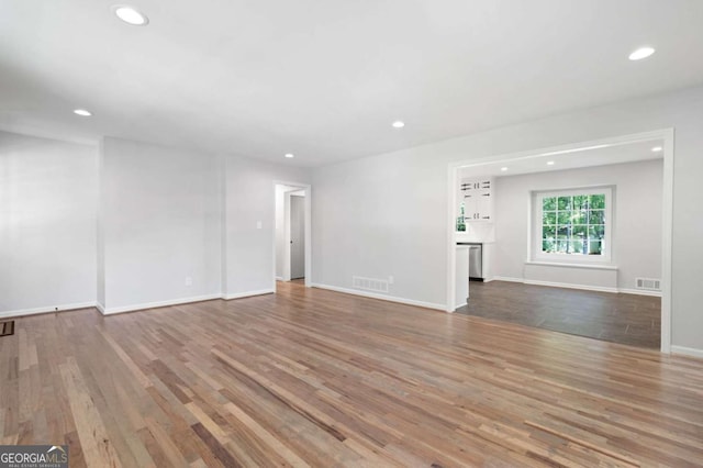 unfurnished living room featuring light hardwood / wood-style floors