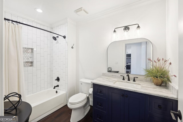 full bathroom featuring vanity, toilet, ornamental molding, shower / tub combo with curtain, and wood-type flooring