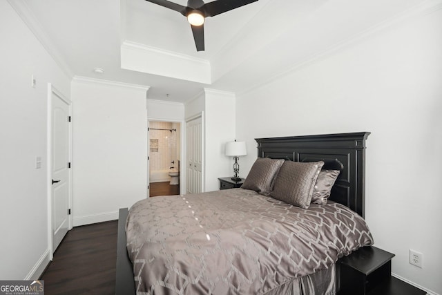 bedroom featuring ceiling fan, dark hardwood / wood-style flooring, crown molding, and a closet