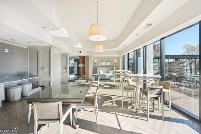 dining room with light parquet floors