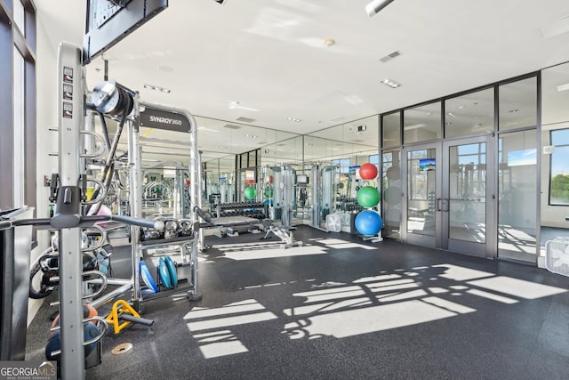 exercise room featuring french doors