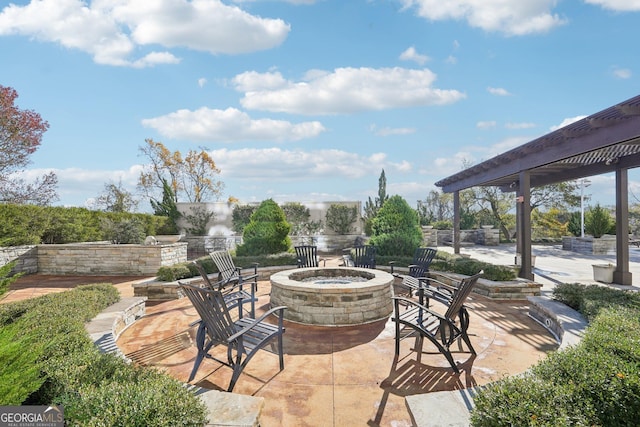 view of patio / terrace with an outdoor fire pit