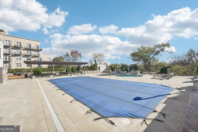 view of pool featuring a pergola and a patio