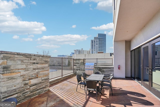 view of patio featuring a balcony