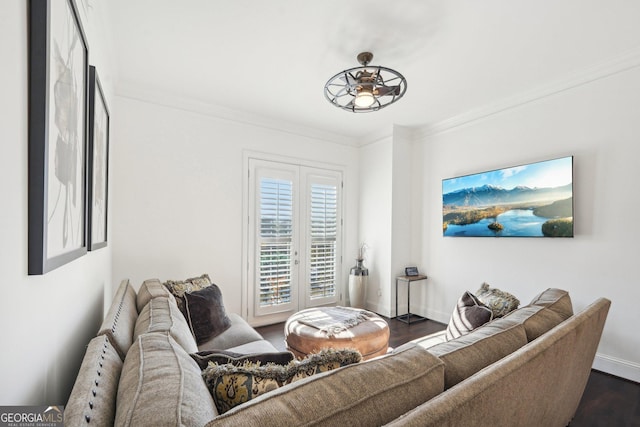 living room featuring ceiling fan, crown molding, and dark wood-type flooring