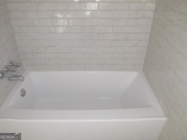 bathroom with a tub