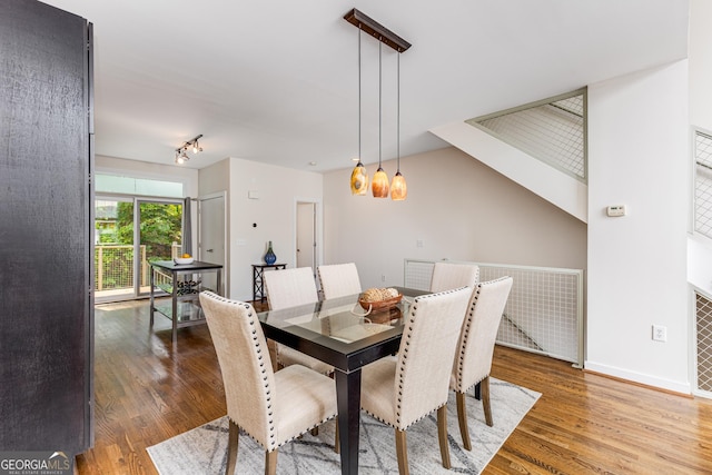 dining space featuring hardwood / wood-style flooring